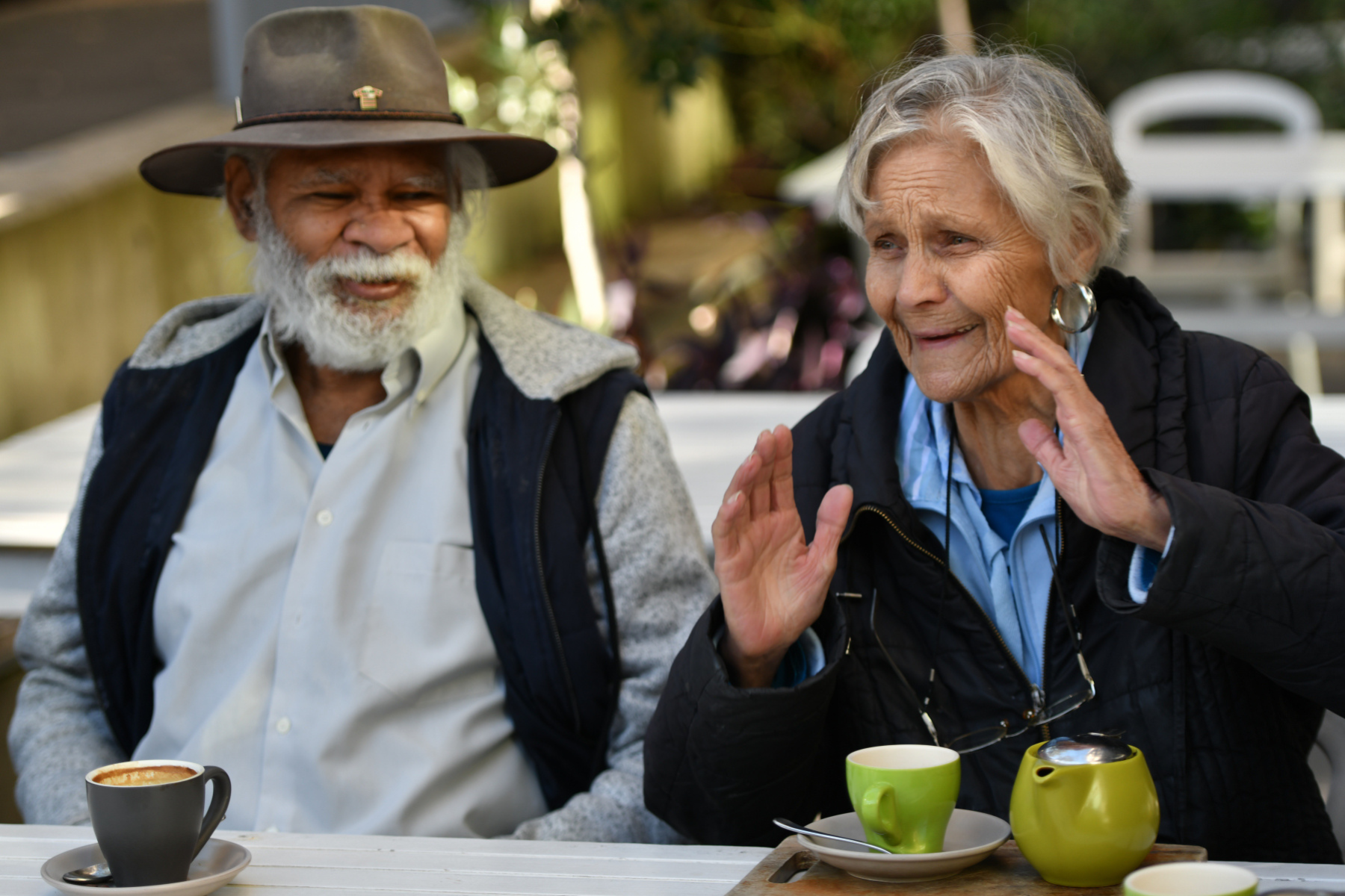 First Nations Elders accessing the community for morning tea with assistance from support workers