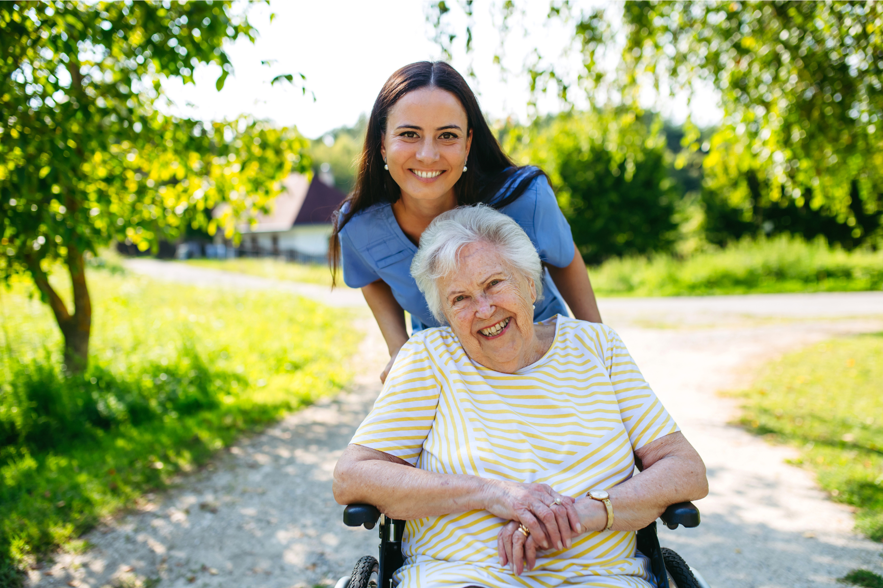 Young training support worker with elderly NDIS participant accessing the community
