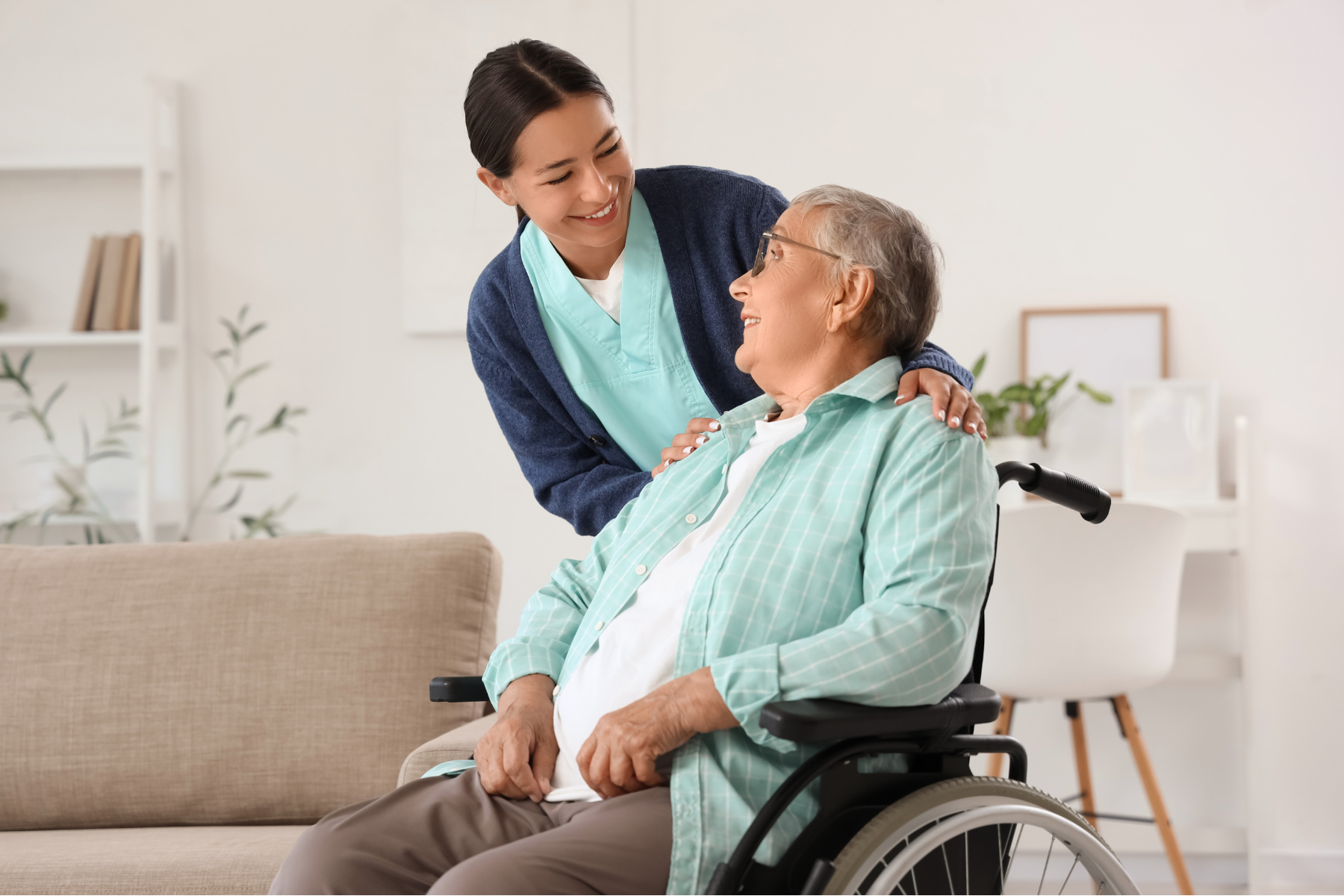 Elderly woman in her home talking with a Haven Home & Support Services worker