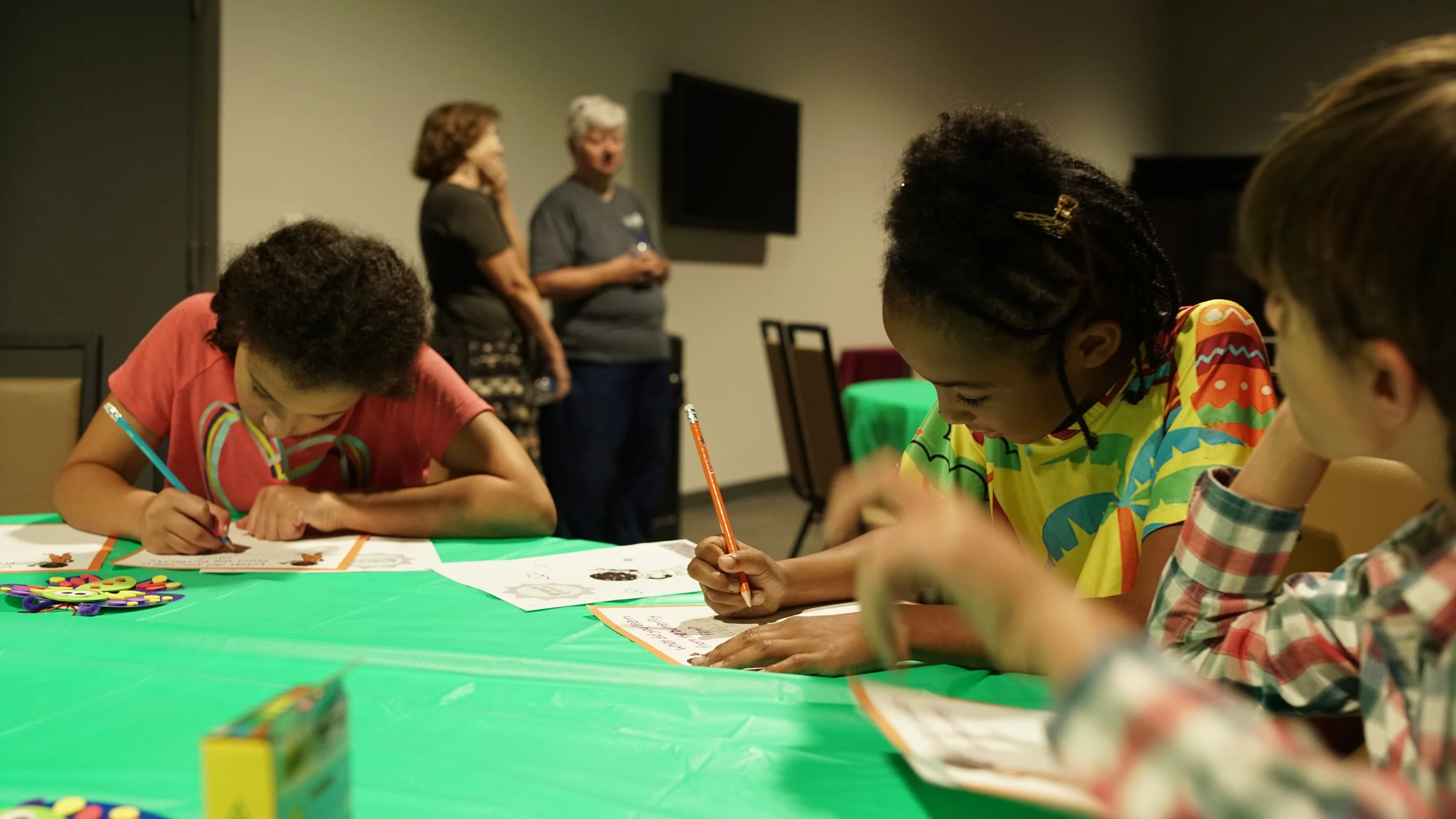 Children write during the Writers Lab at the 4th Annual It's Cool to Learn in Roanoke