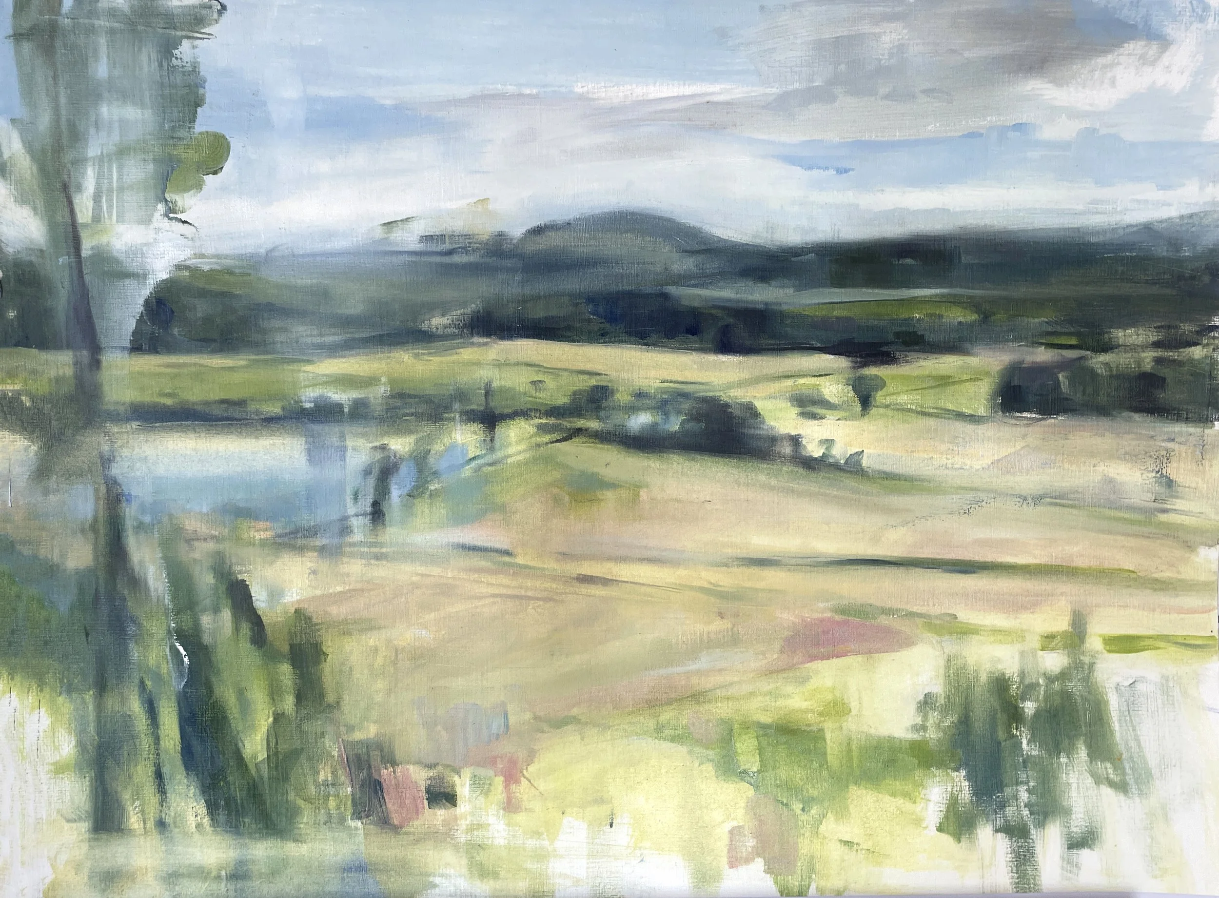 A watercolor painting of a landscape with a river, trees, green fields, and hills under a cloudy sky.