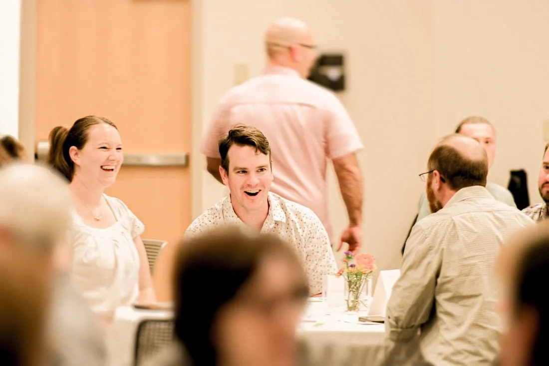 A group of people attend a banquet fundraiser for the local chapter of the Young Life ministry in Ashland, Ohio