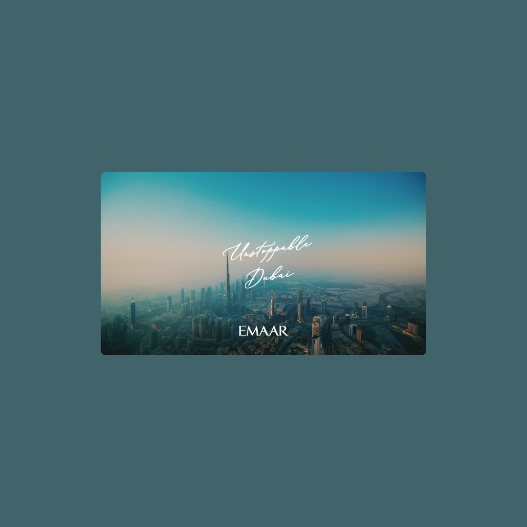 Aerial view of Dubai skyline with tall skyscrapers and the Burj Khalifa, under a clear sky, with the text 'Unstoppable Dubai' and 'EMAAR' overlayed.