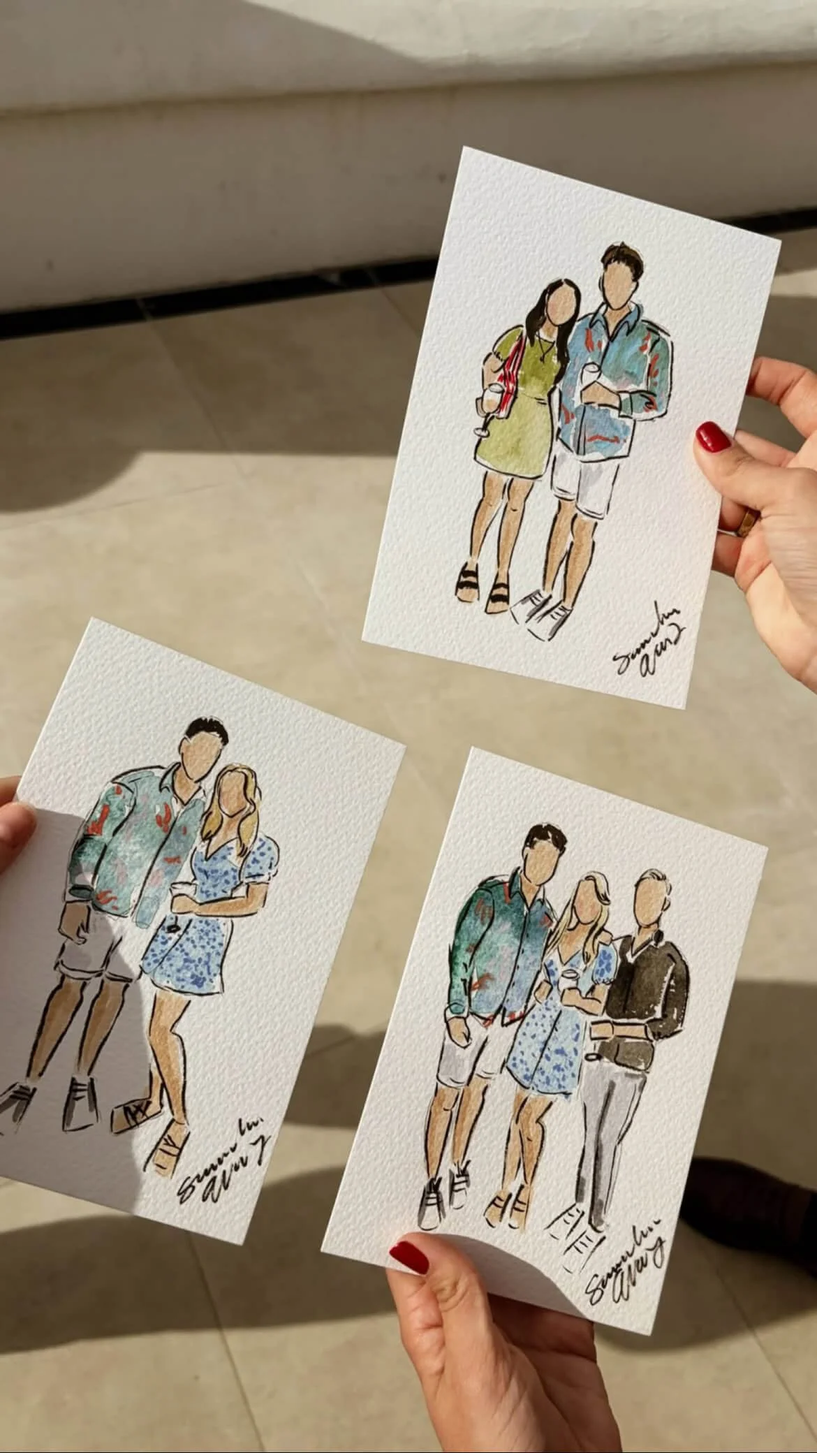 Three hand-held illustrated postcards featuring couples dressed in summer clothing, with signed signatures at the bottom.