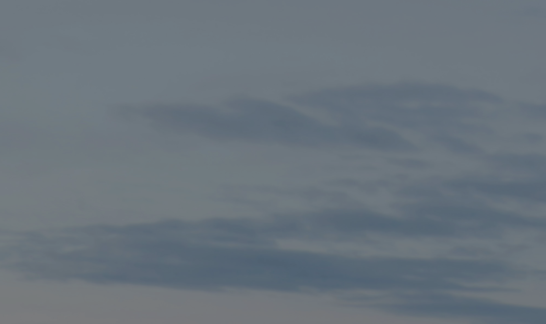 Sky with scattered clouds.