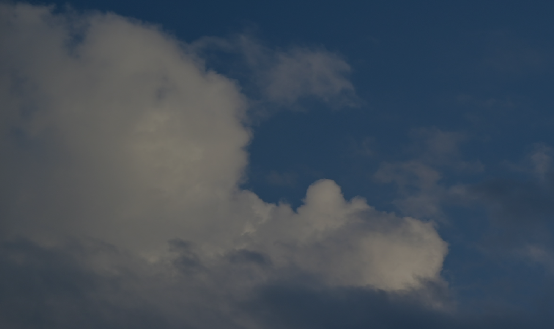 Sky with large white and gray clouds.