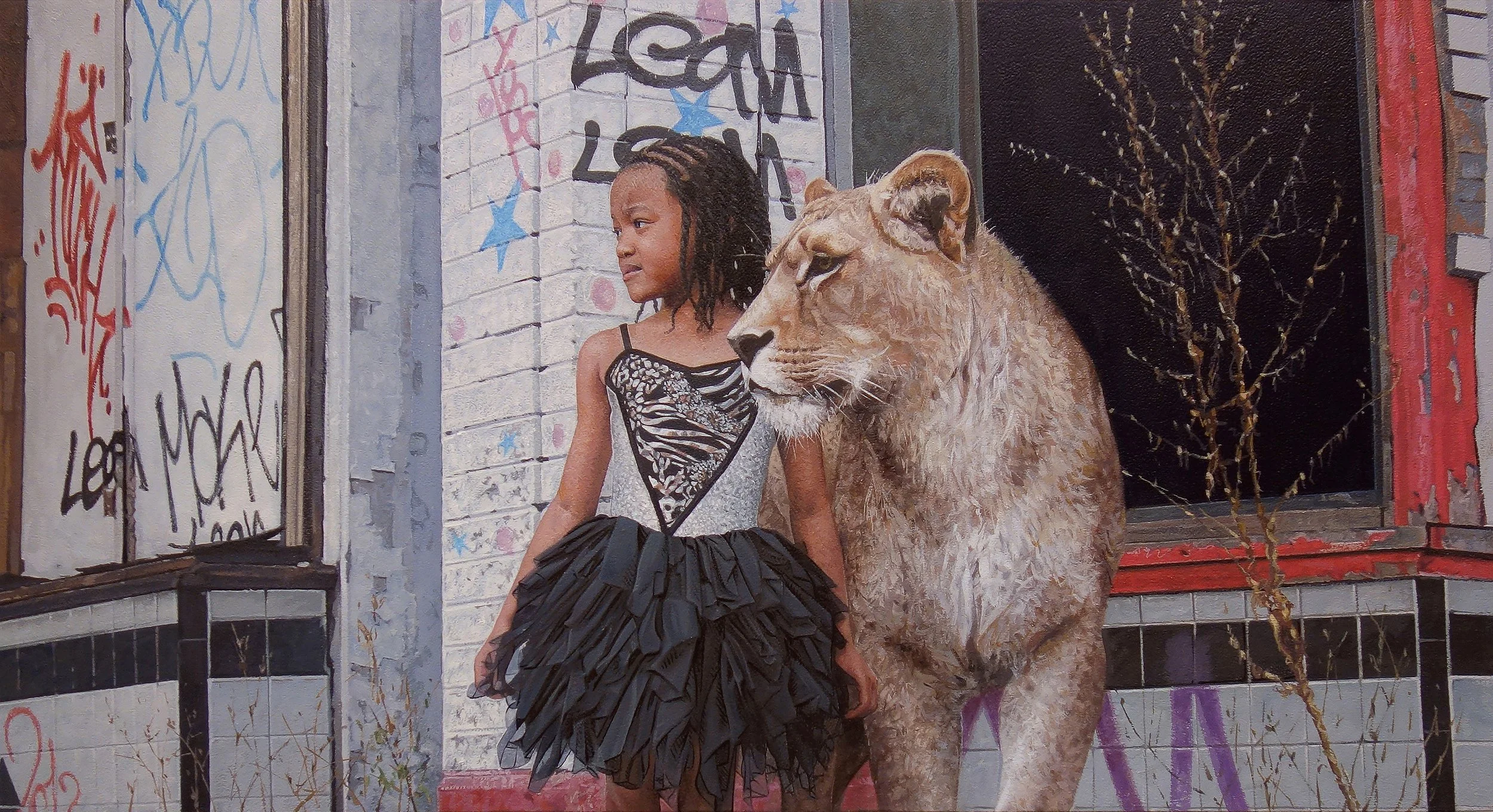 A young girl with braided hair wearing a black and white dress and a black ruffled skirt standing next to a lion, in front of an old building with graffiti and peeling paint.