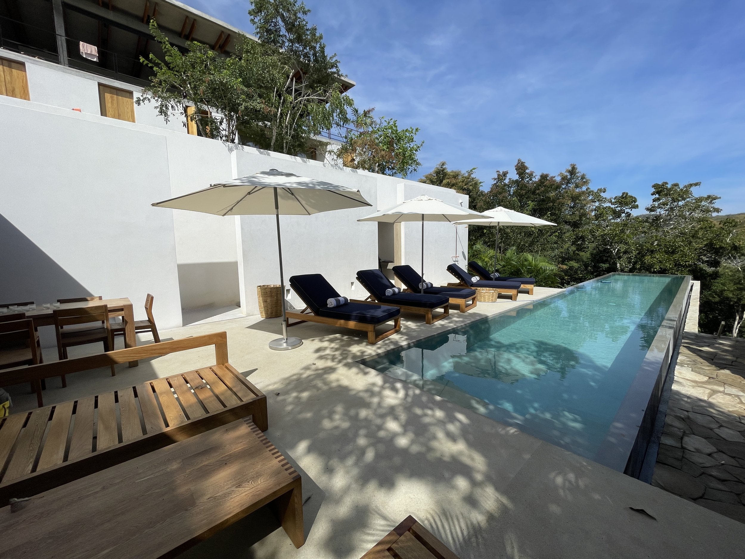 An image of the Pool Area, with lounge sitting around it.