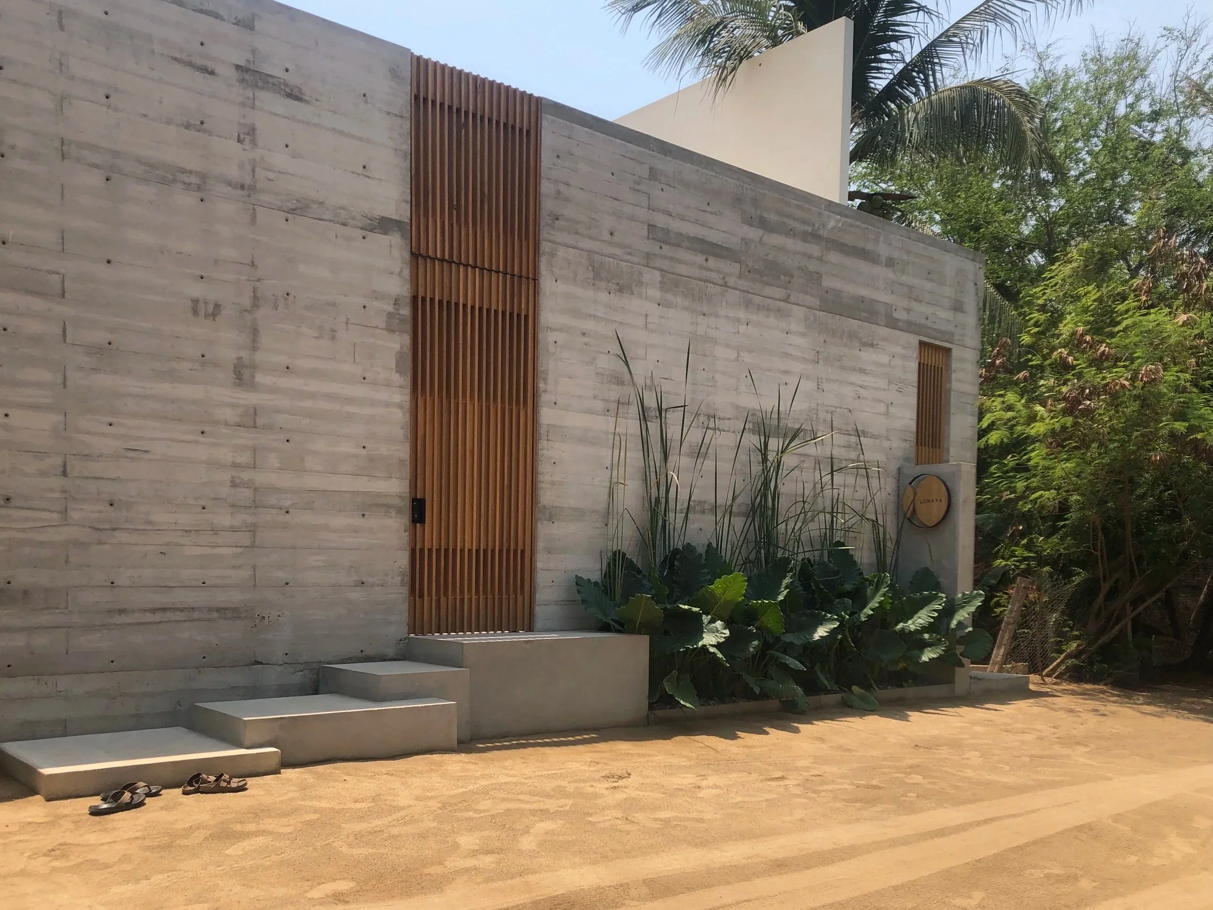 Street entrance to project. Concrete wood and plants. In Puerto Esocondido Oaxaca.