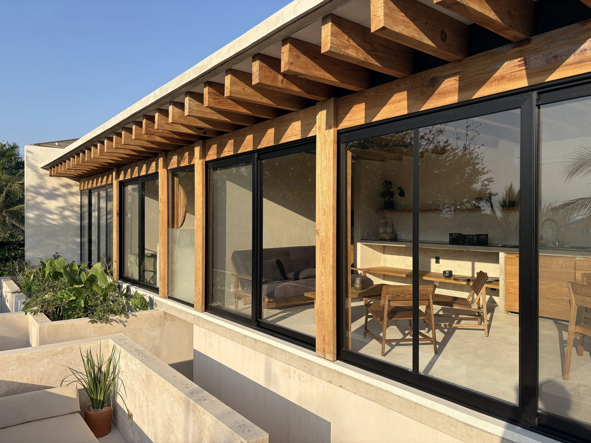 With a wood facade and a visible wood structure. The building emphasise its lightness and openness to the surroundings 