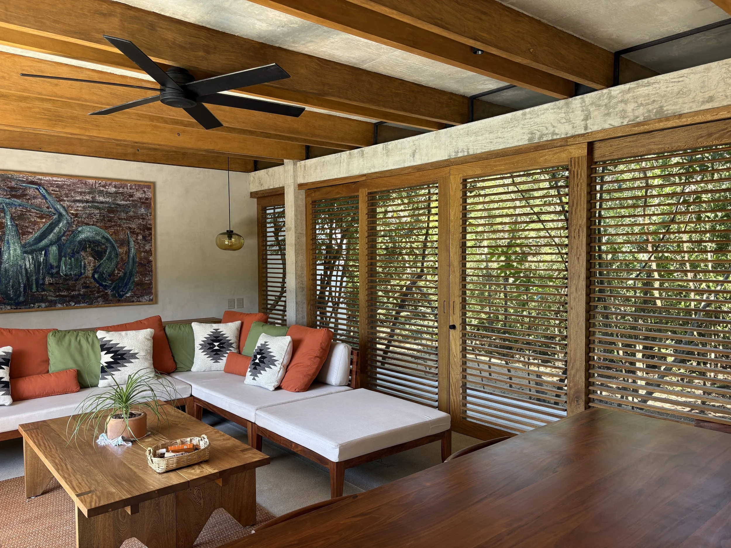 Living space with the wood shouters to control light during the day