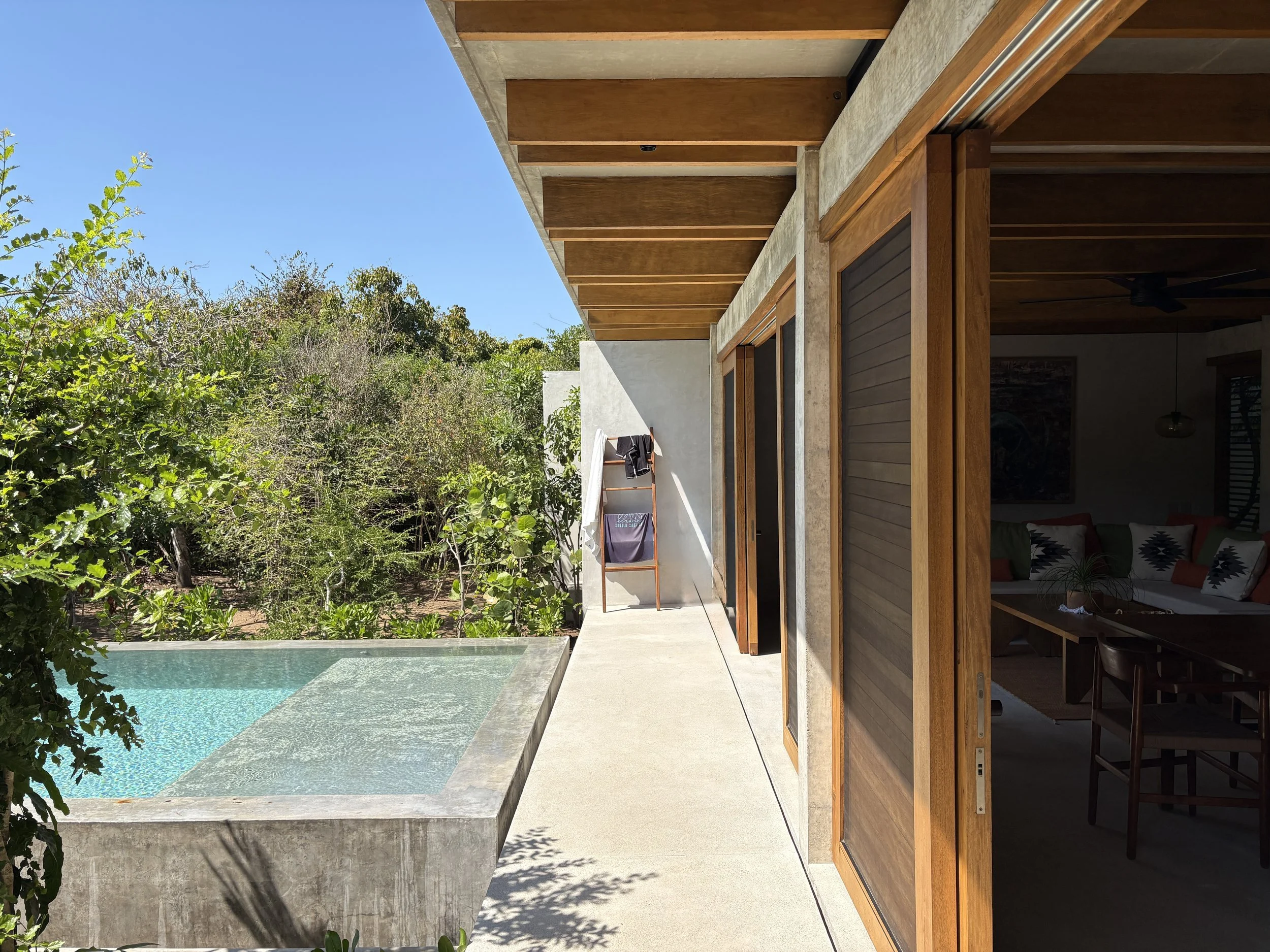 The entrence walkway acts like the terrace into the pool