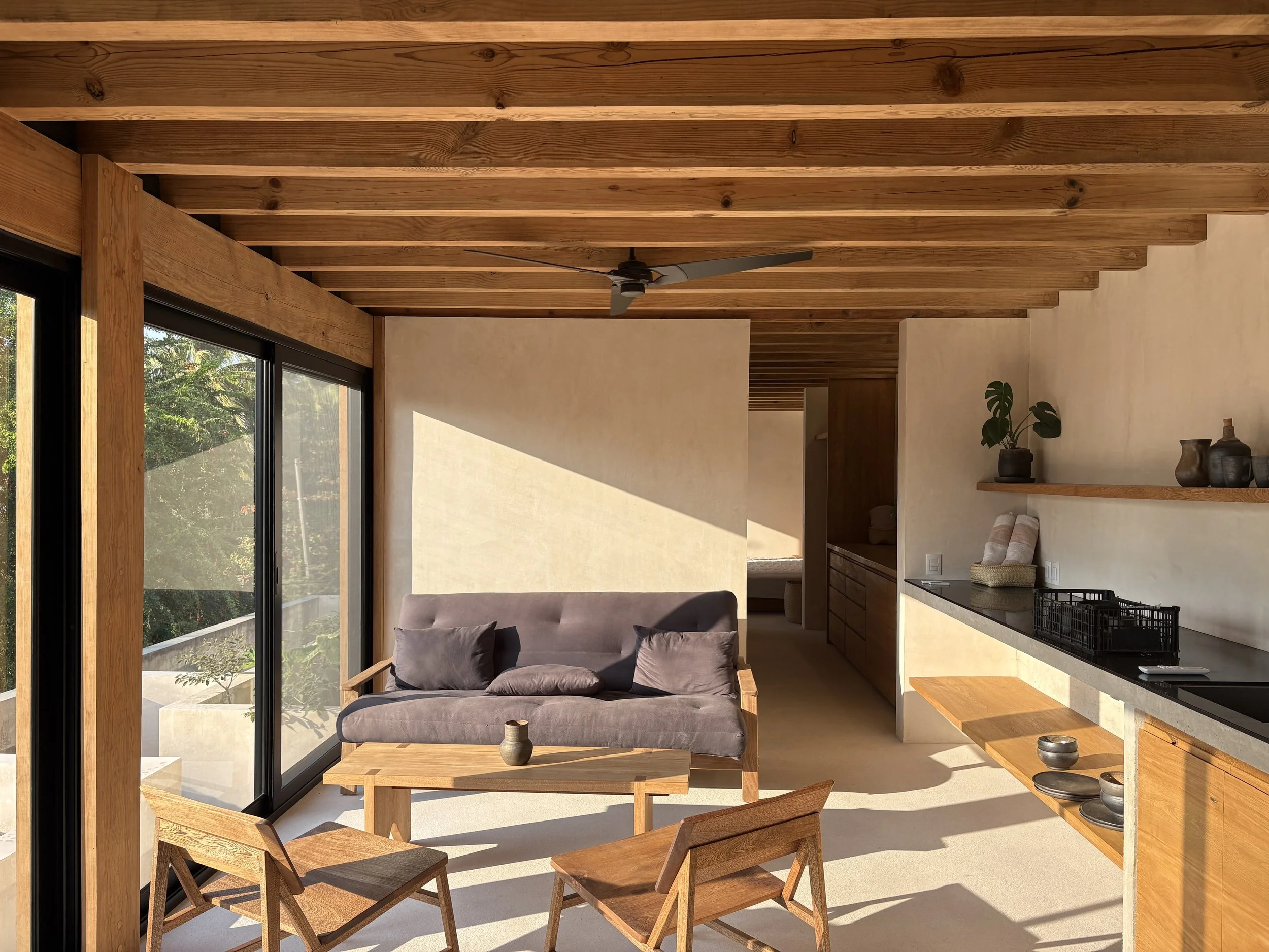 Living space open to the sunset view. Perfect place to relax and read while you see the ocean. Or journal