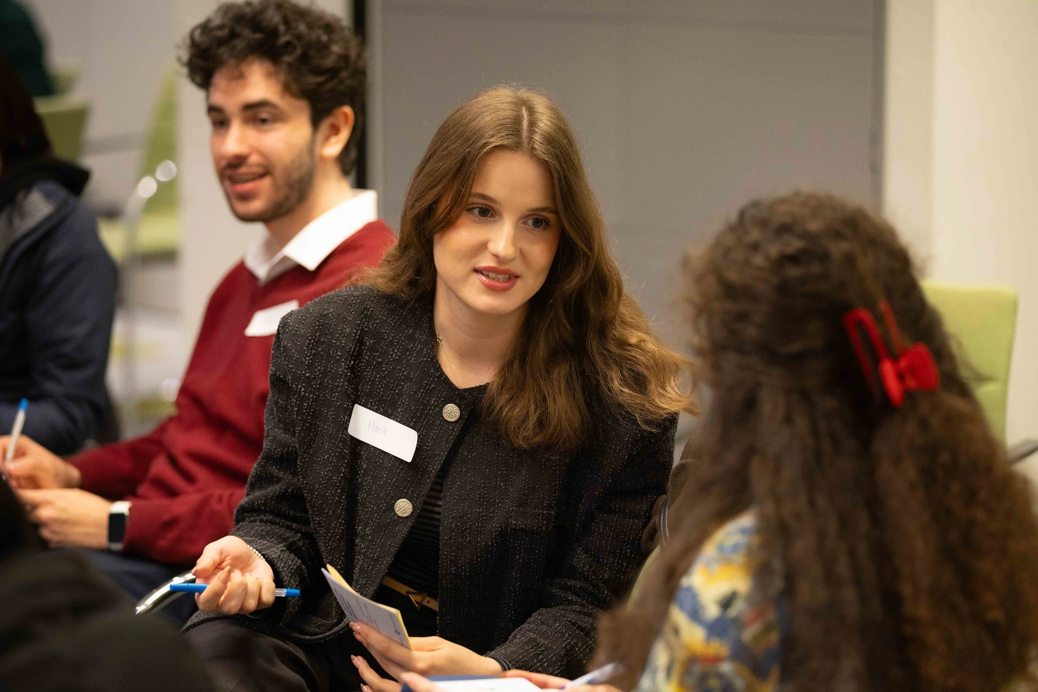 workshop setting with participants in conversation with each other