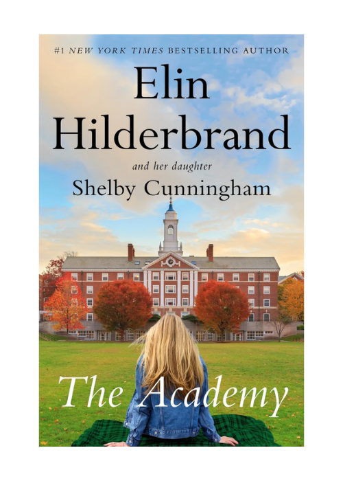 Book cover for 'The Academy' by Elin Hilderbrand and Shelby Cunnigham. Features a young girl with blonde hair sitting on a blanket on the grass, facing a large brick college building with a clock tower, surrounded by trees with autumn foliage, under 