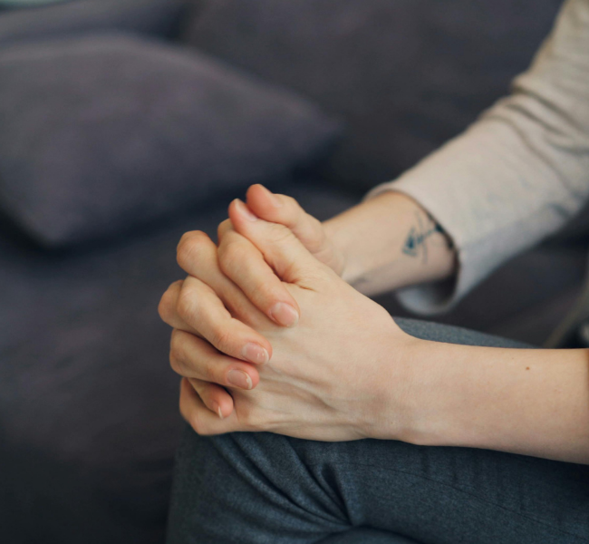 Hands clasped in tension. Hands communicate what faces perform over