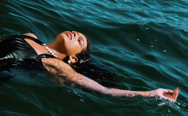 woman peacefully floating in the ocean