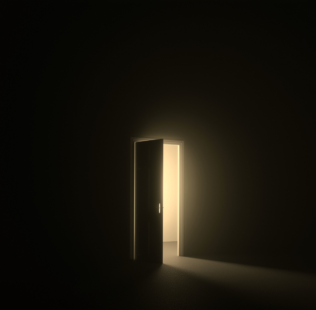 dark room with an open doorway filled with light