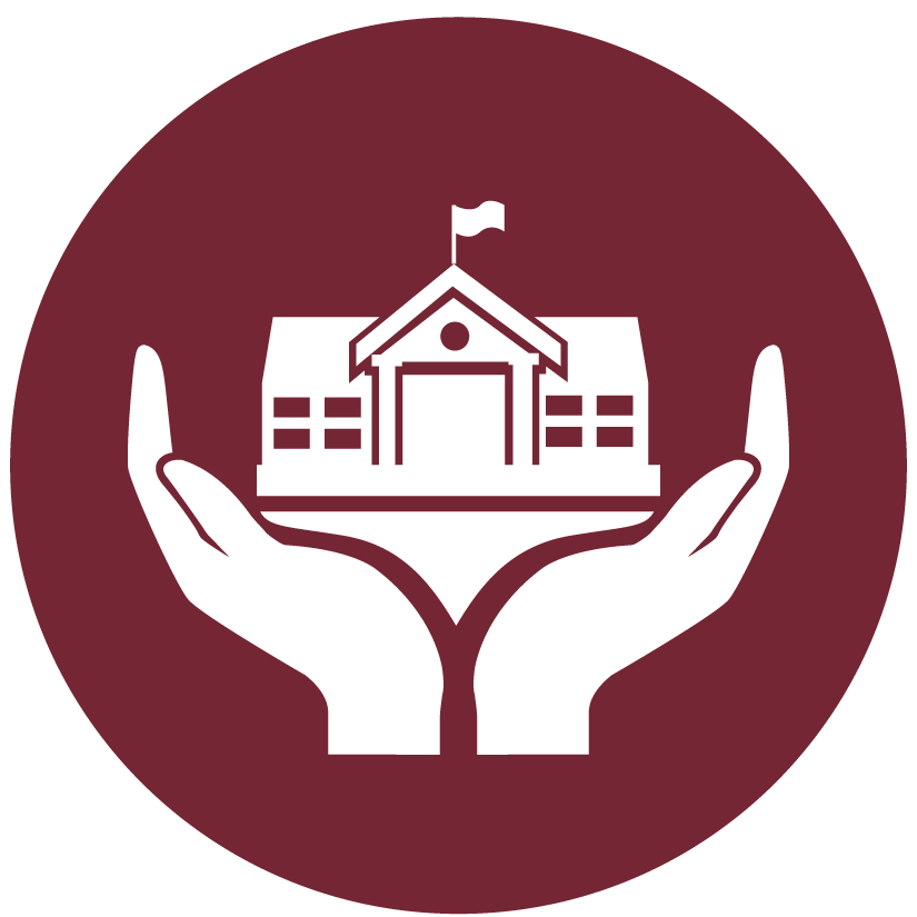 A fluffy orange cat reading a large open book on a patterned blanket in a cozy room.