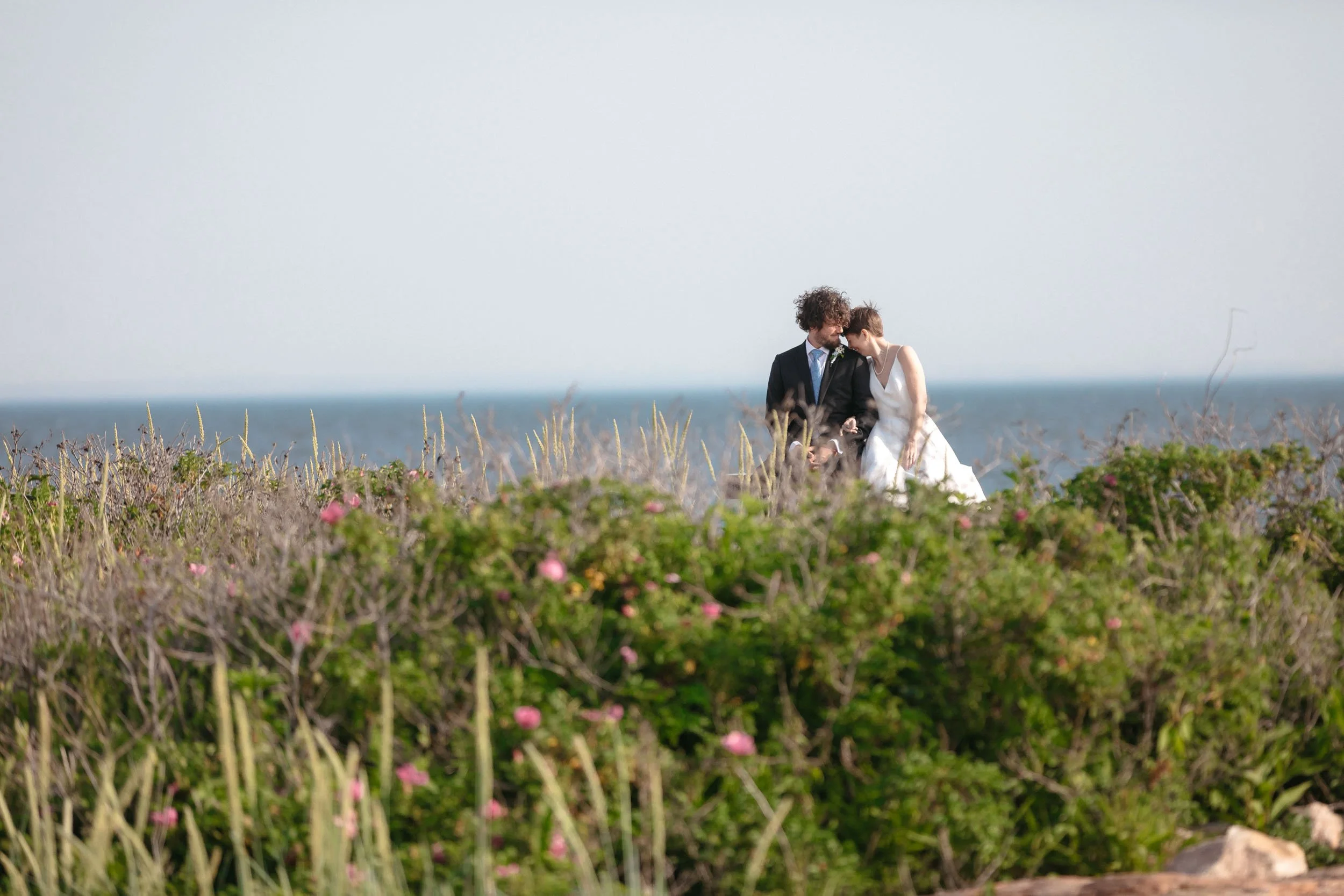 Documentary-style wedding photograph focused on subtle gestures