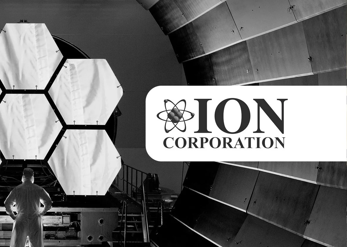 A researcher in a lab coat stands in front of a large scientific instrument with hexagonal components, with the logo 'ION Corporation' overlayed on the image.