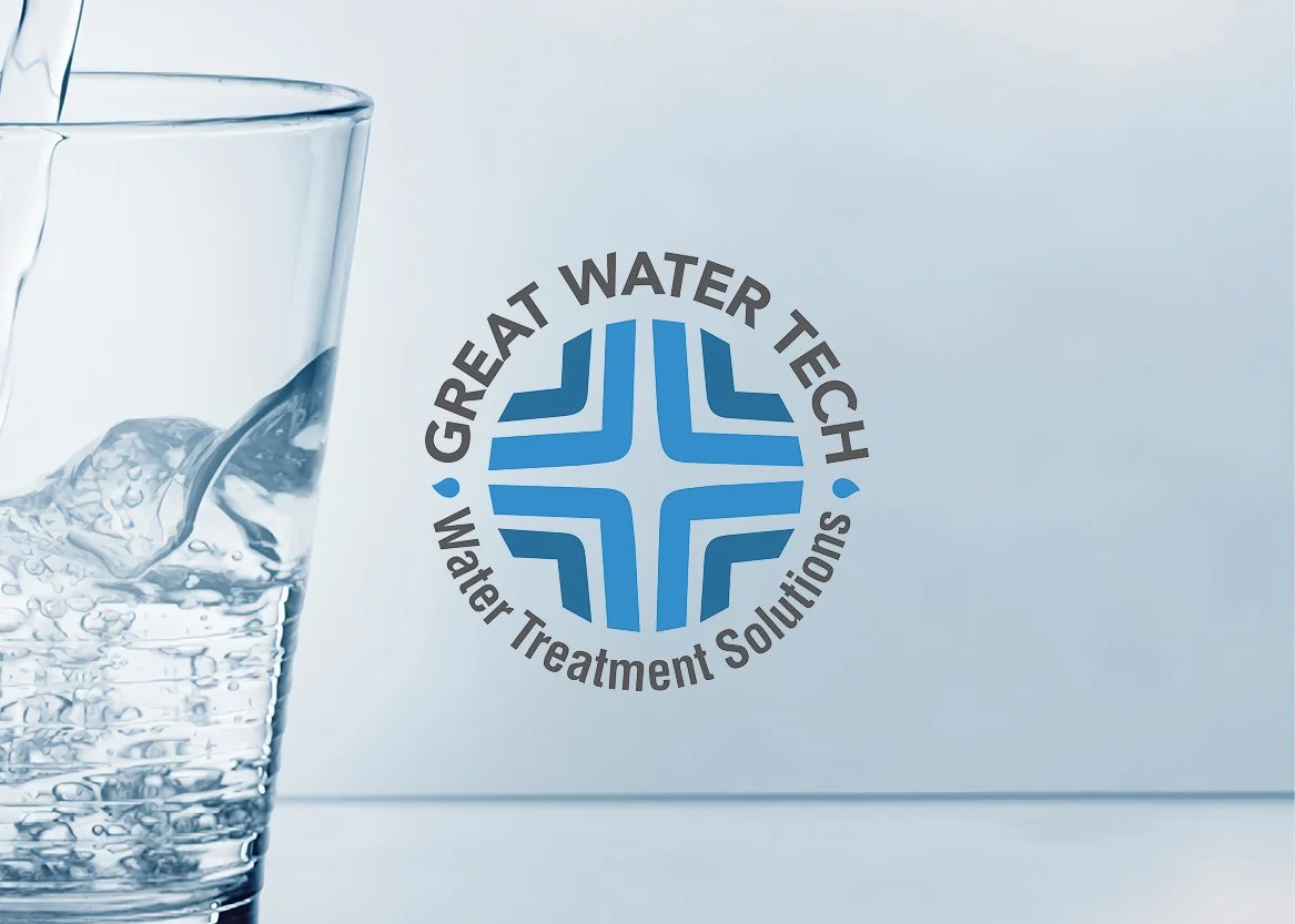 A glass of water with ice cubes being poured into it, next to a logo that says 'Great Water Tech Water Treatment Solutions' with a blue geometric design.