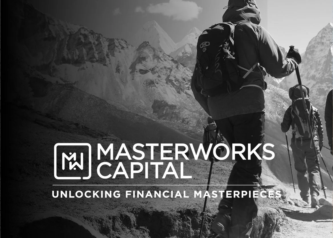 People hiking in a mountain landscape with snow-capped peaks, carrying backpacks and trekking poles.