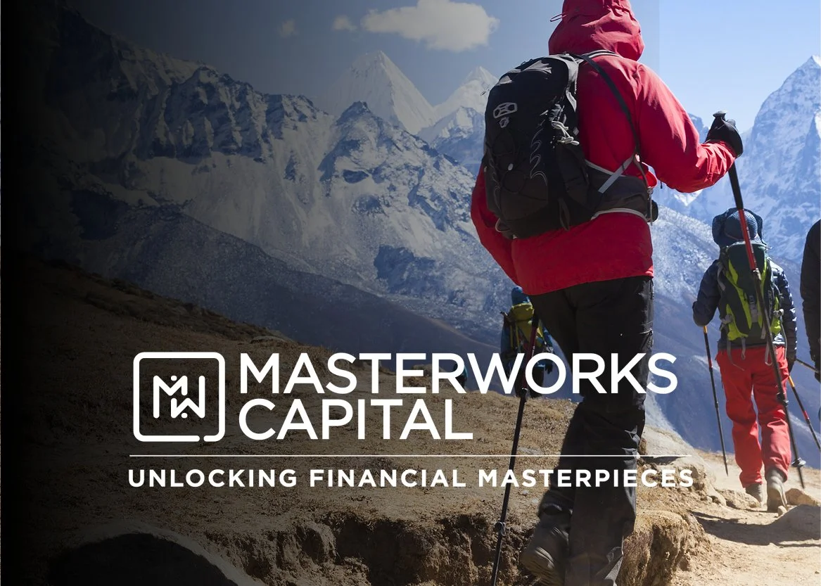 Group of hikers trekking in the mountains with snowy peaks in the background