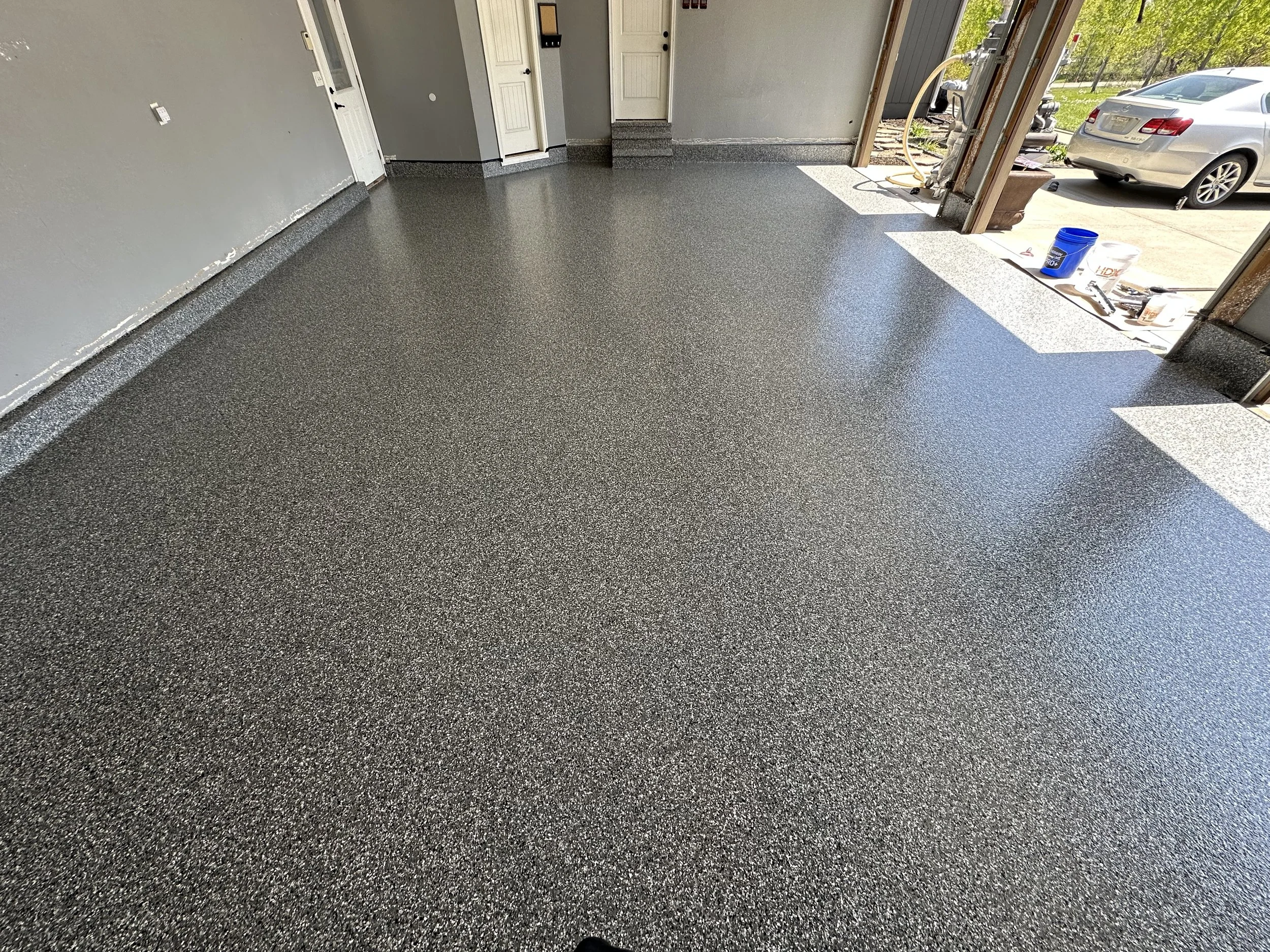 Fresh flake or quartz installed in Kansas City garage or entry way by Precision Kc Coatings