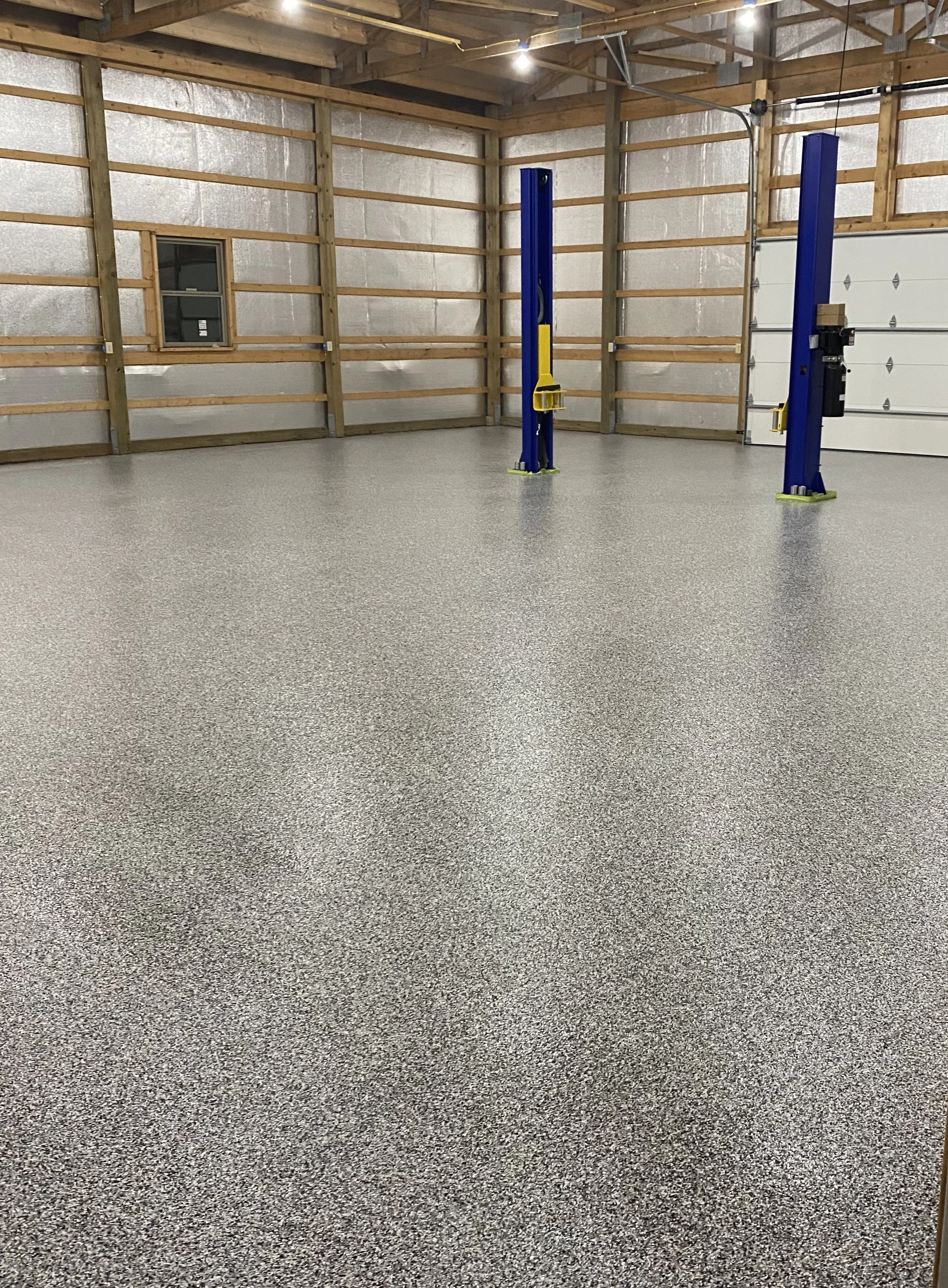 Epoxy garage floor coated with a polished finish in kanas city residential space
