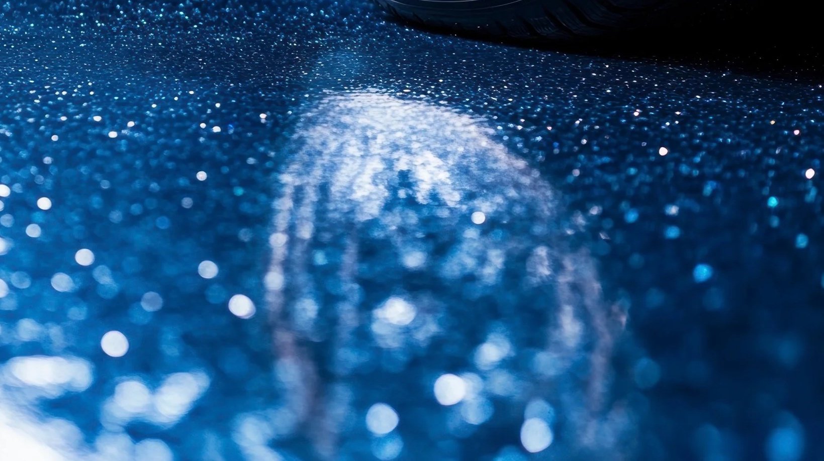 Close-up of high gloss glitter epoxy floor finish by Precision KC Coatings