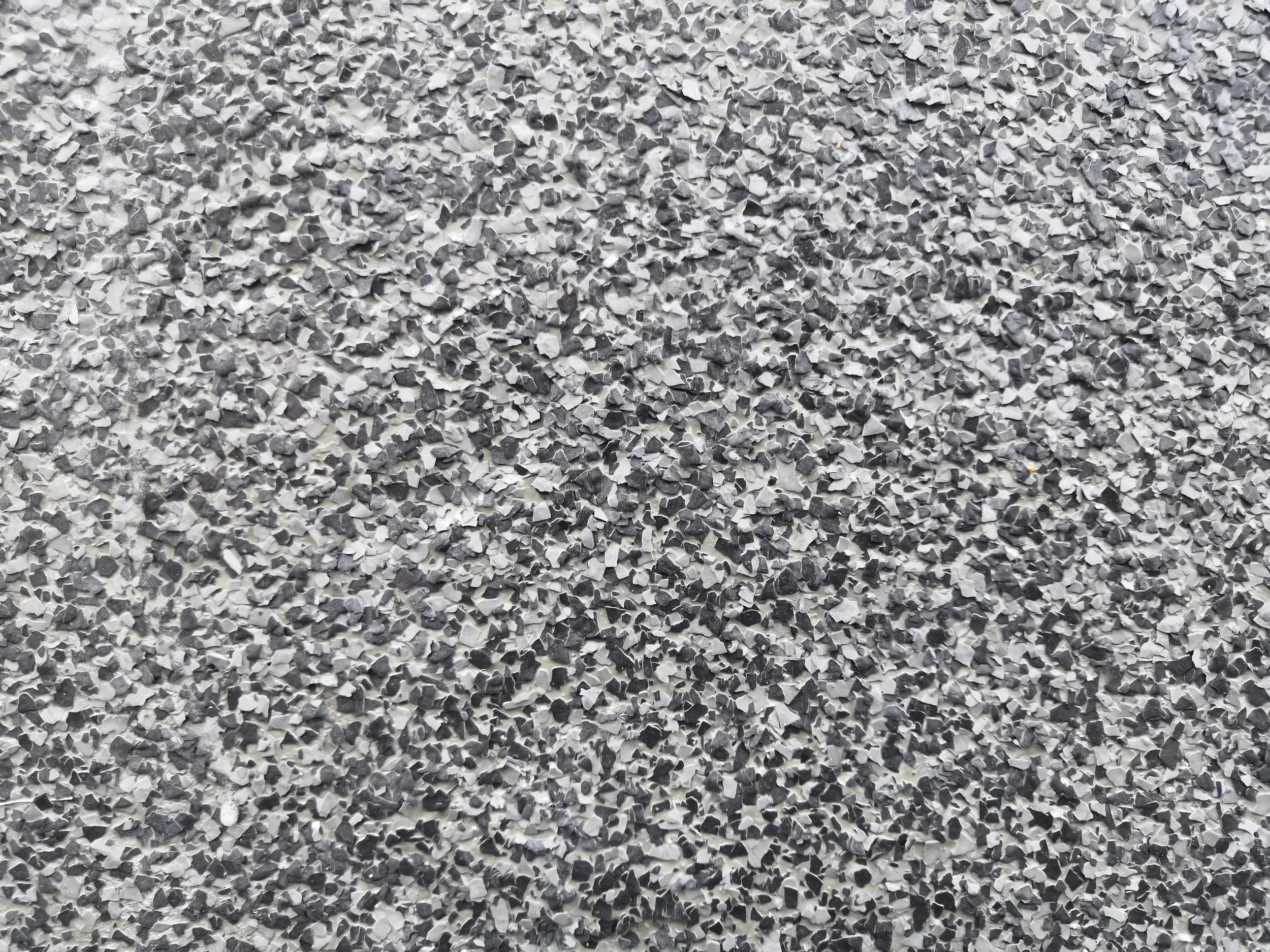 Close-up of flake epoxy floor system installed in a commercial space in Kansas city by Precision KC Coatings