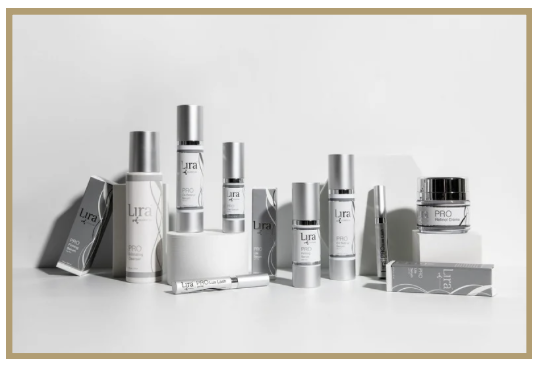Collection of skincare and cosmetic products arranged on a white surface with a light gray background.
