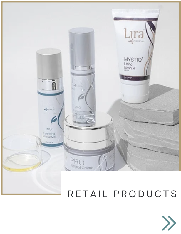 Collection of skincare products including a hydrating mineral mist, a gel cream, a lifting masque, and a retinol creme displayed with rocks and a small glass container of oil.