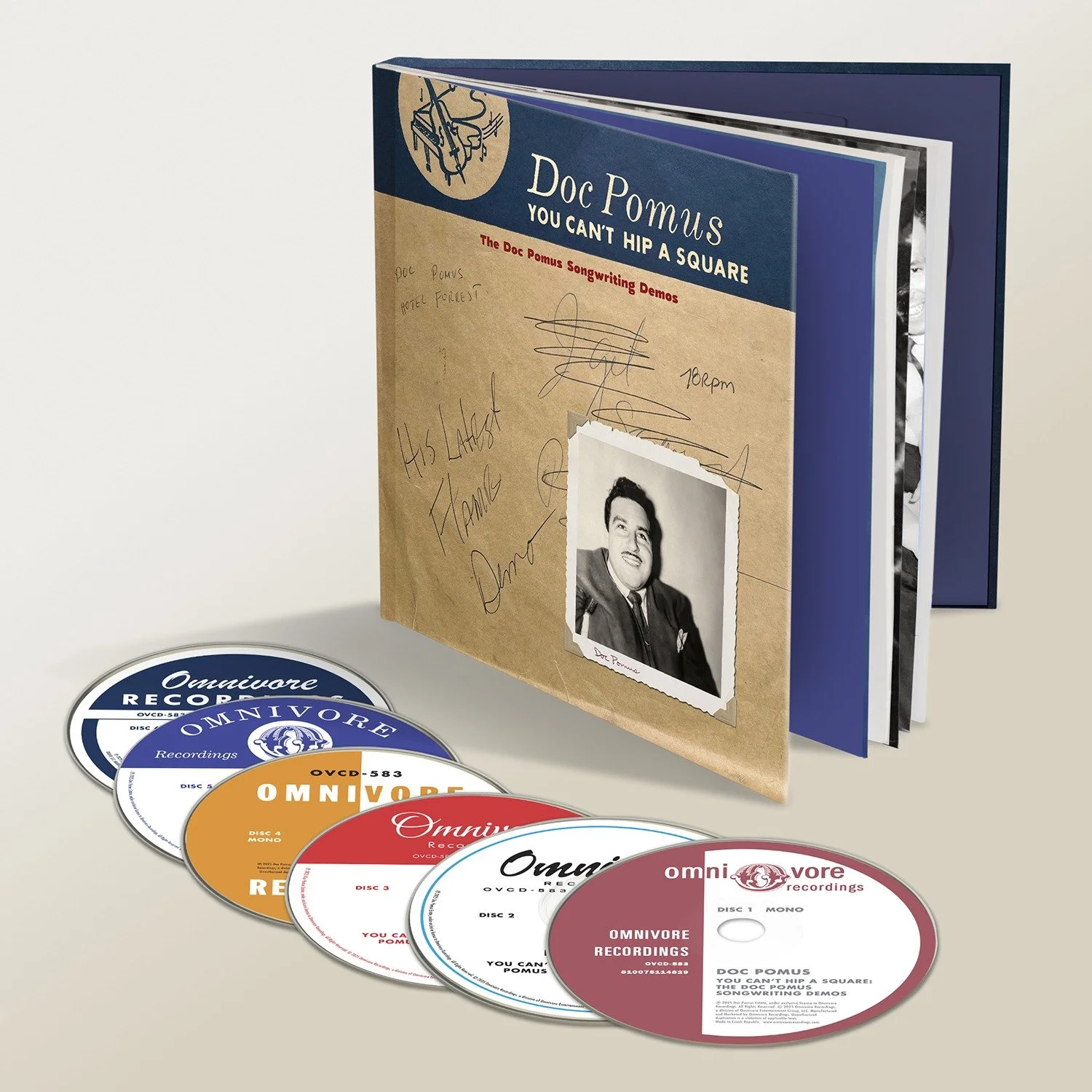 A CD box set titled 'Doc Pomus: You Can't Hip a Square' with multiple CDs in front, including blue, white, orange, red, and maroon discs, alongside a booklet with signatures and a black-and-white photo of Doc Pomus.