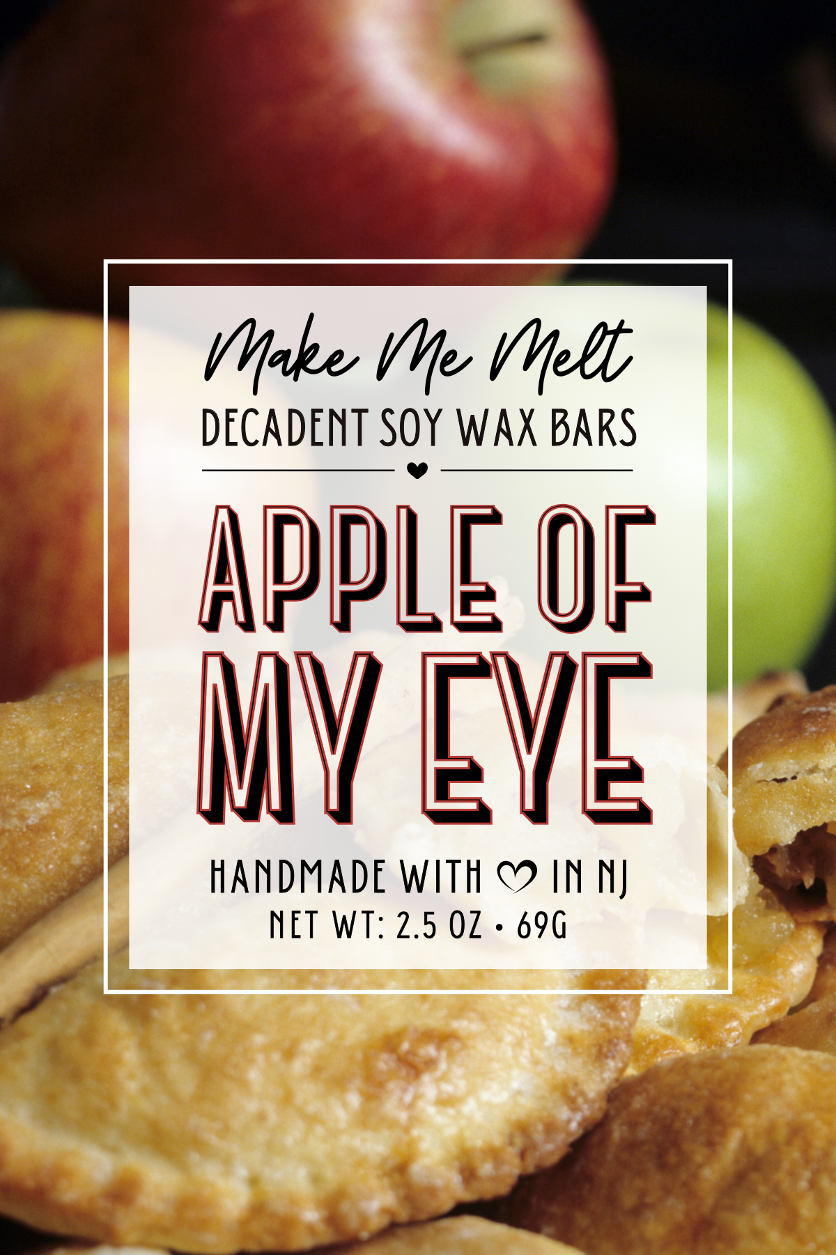 Close-up of a label on a package of artisan soy wax bars with apples in the background, indicating the scent 'Apple of My Eye' and that they are handmade in New Jersey.