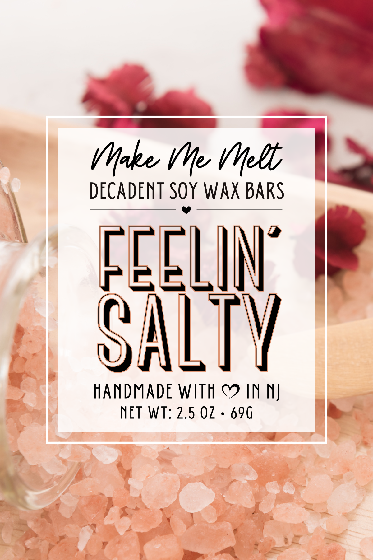 Label for Make Me Melt decadent soy wax bars with the scent 'Feelin' Salty,' handmade in NJ, 2.5 oz, 69g, on a background of pink Himalayan salt.