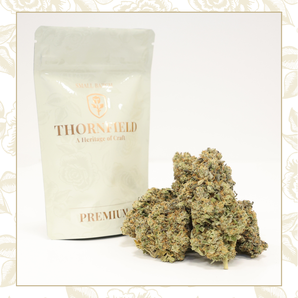 Close-up of cannabis buds in front of a package labeled 'Thornfield Premium' with a white background.