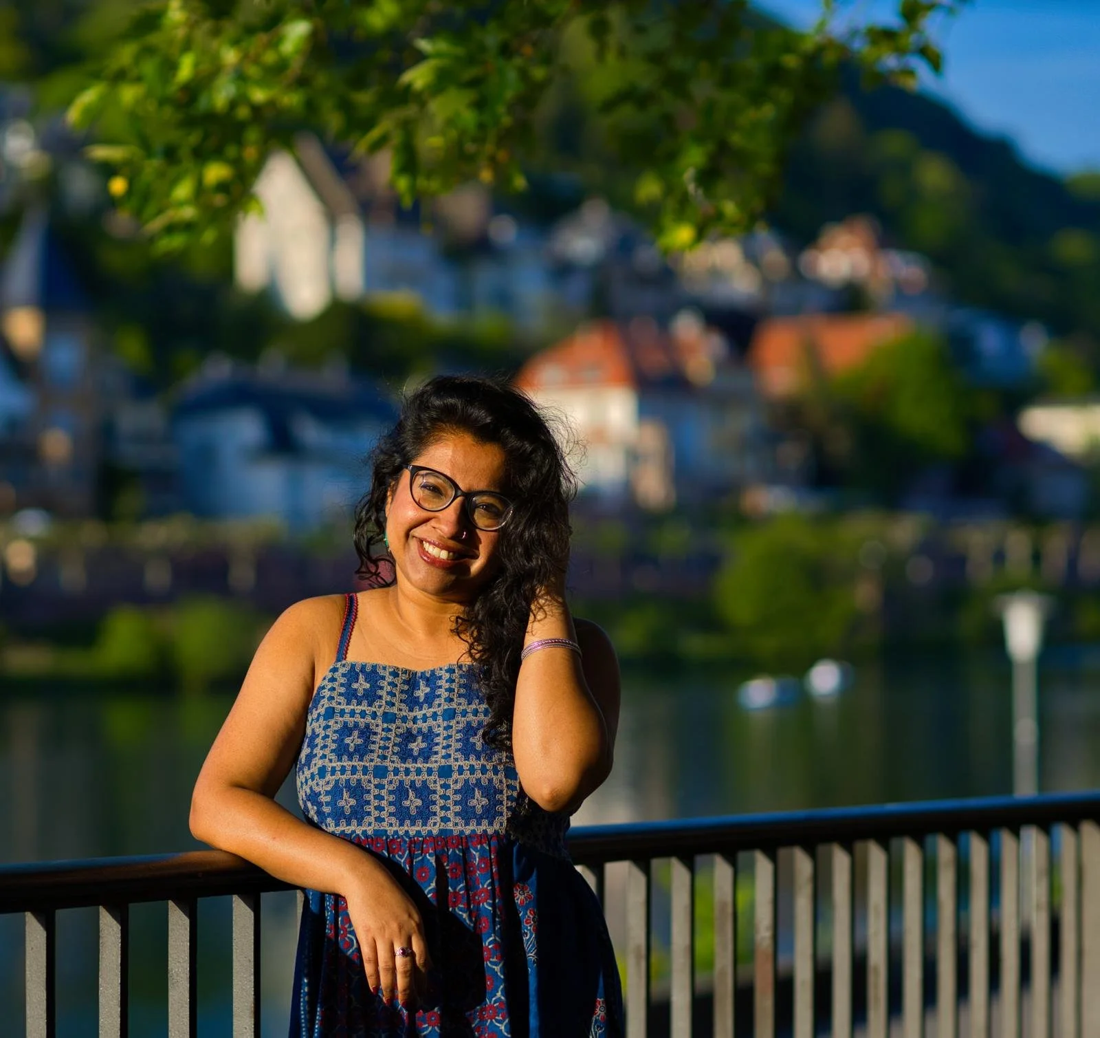 Dr. Pallabi Roy, intimacy and relationship coach with the River Neckar, Heidelberg in the background