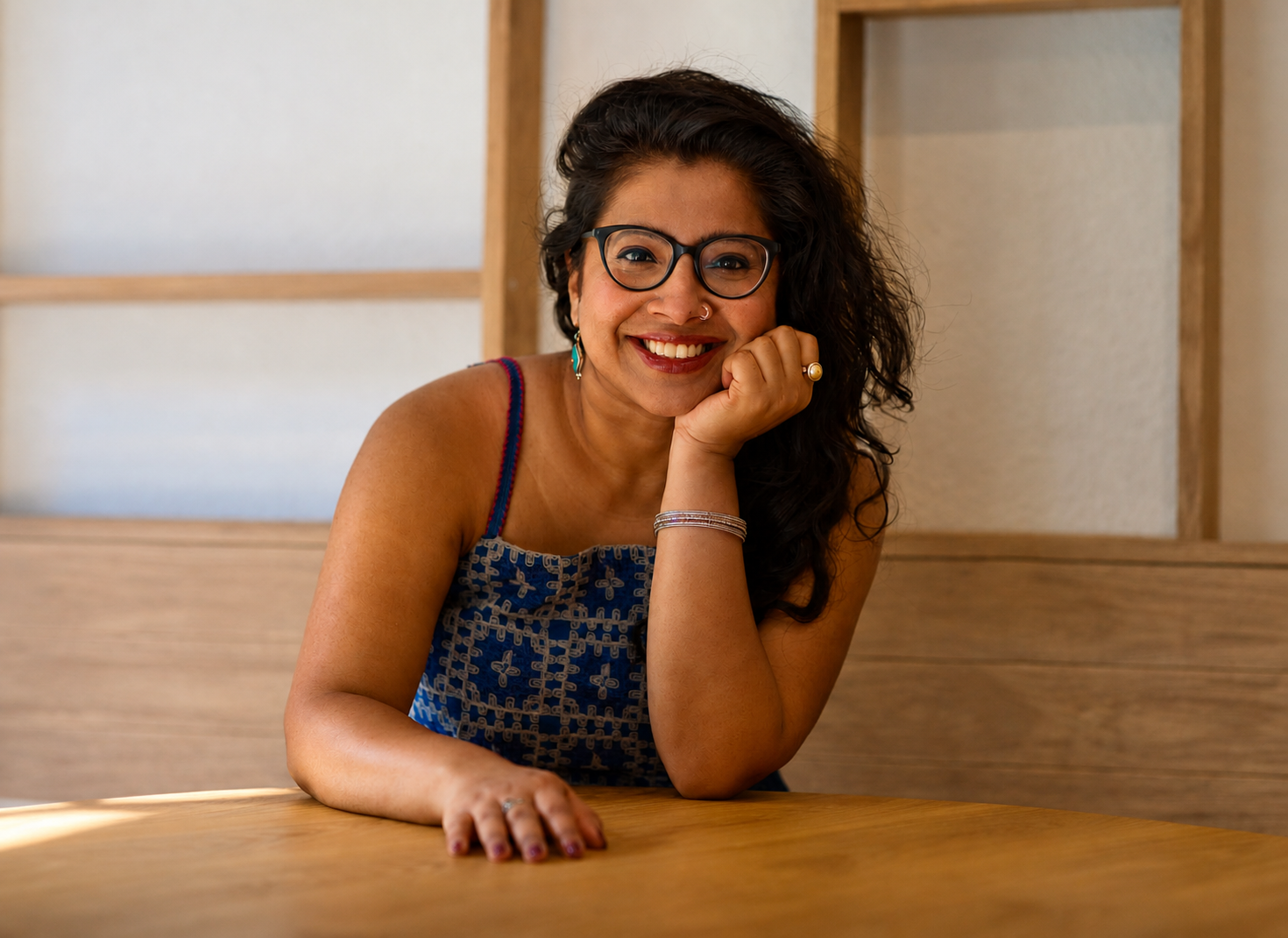 Dr. Pallabi Roy,  sex,  intimacy, & relationship coach, smiling directly at the camera