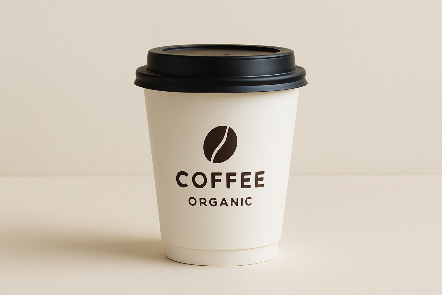 Disposable coffee cup with black lid, featuring a logo of a coffee bean and the words 'Coffee Organic' in brown on white background.