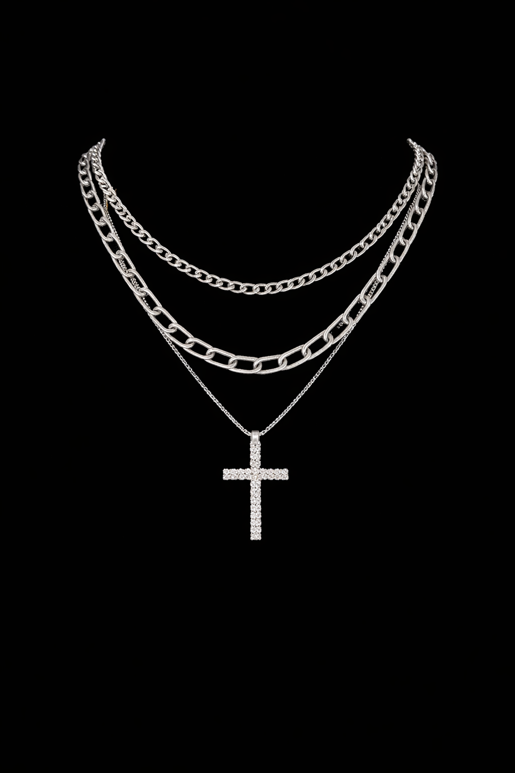 3 chain cross necklace black background.png