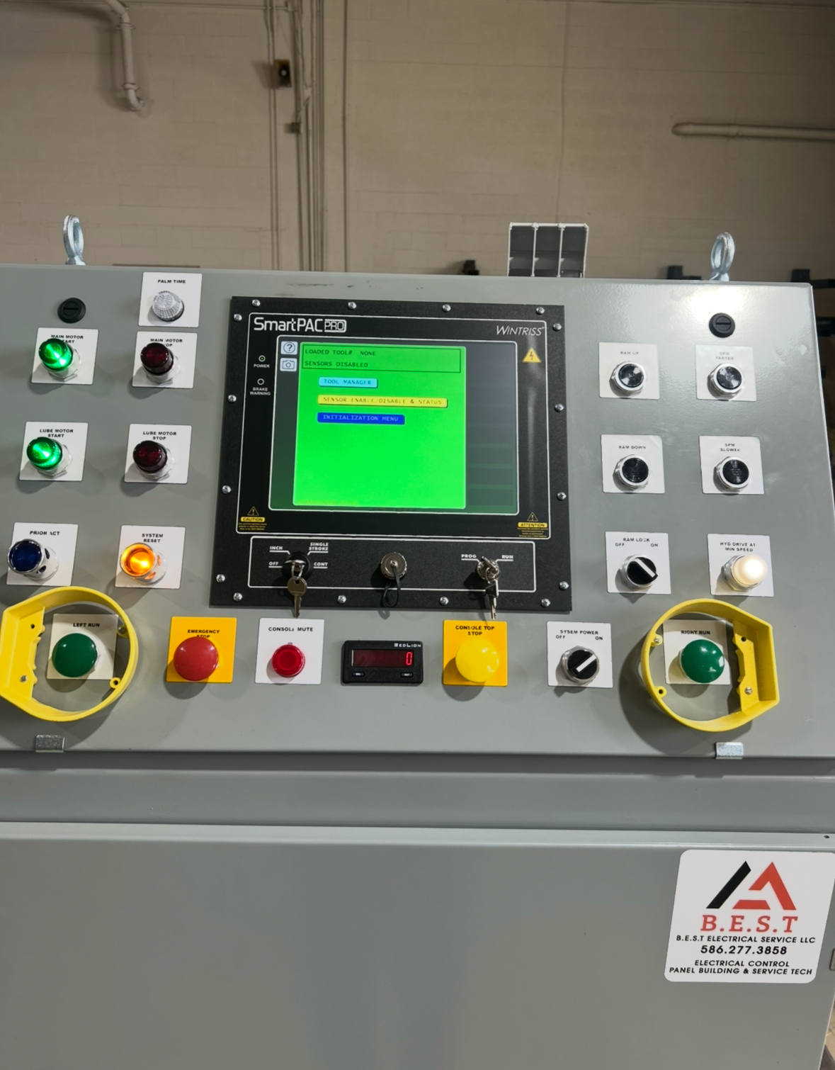 Industrial control panel with buttons, switches, and a digital display, labeled B.E.S.T Electrical Service LLC.