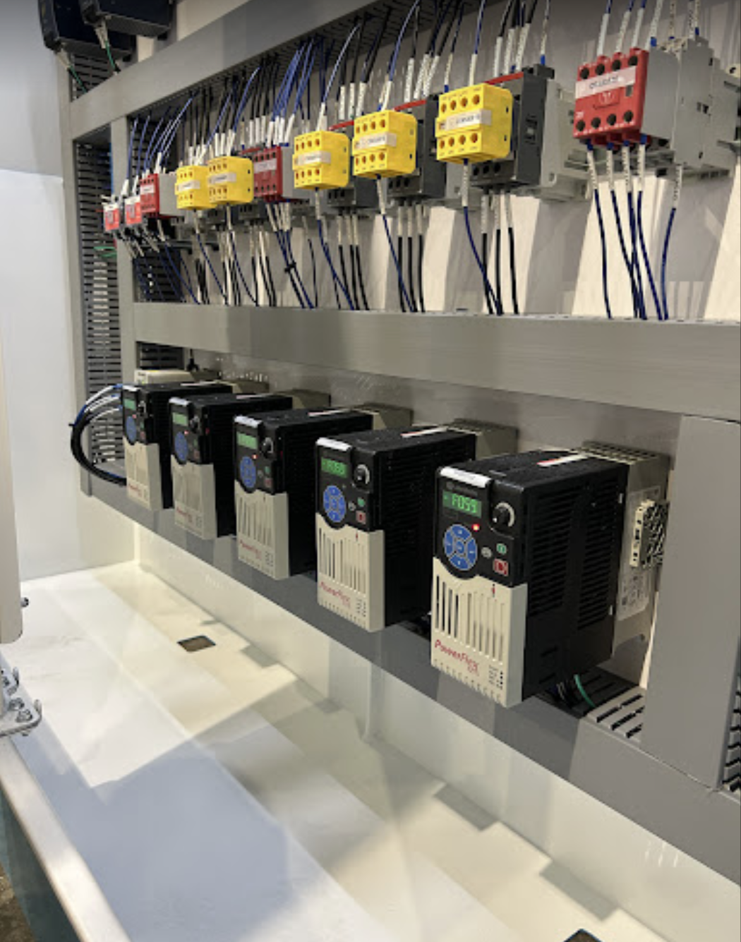 Industrial control panel with multiple electronic devices and wiring.