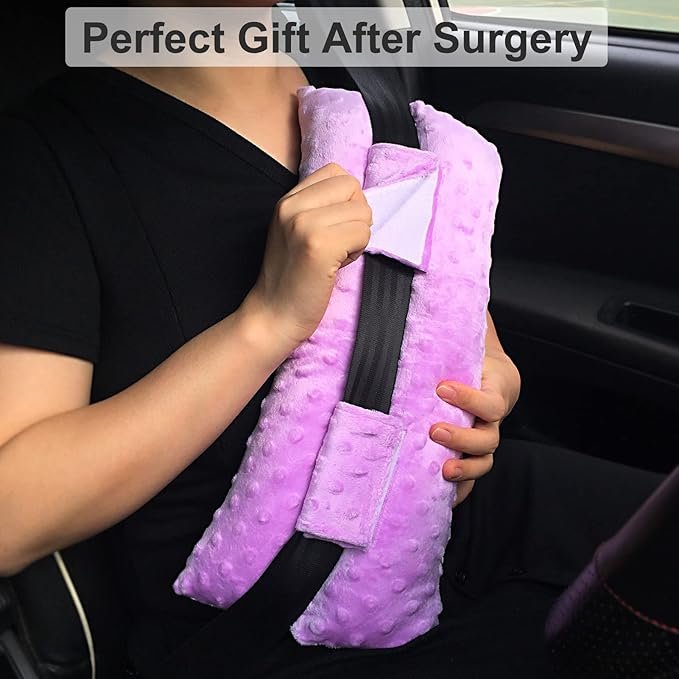 Child in black shirt holding a purple plush pillow with a black strap, sitting in a car, with a caption saying 'Perfect Gift After Surgery.'