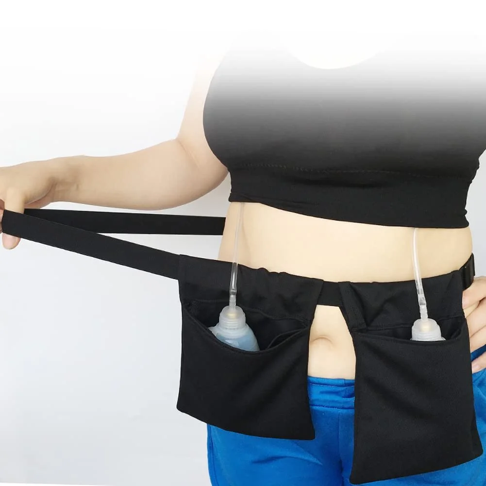 Person wearing a black waist pouch with two bottles attached, extending an arm to the side, against a plain white background.
