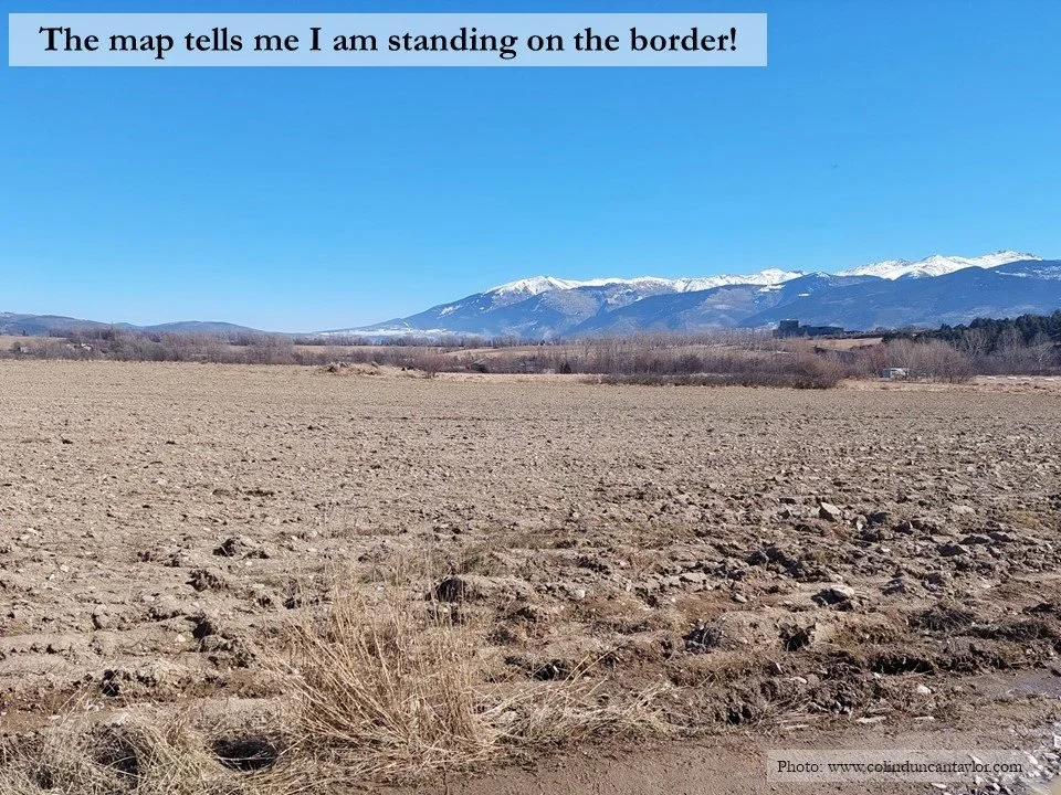 A ploughed field straddles the border between France and Spain near Puigcerda.