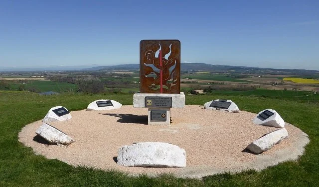 Around the perimeter of the Cathar Memorial at Les Casses, eight blocks of stone carry plaques listing the names of towns and villages where other bloody events took place during the Cathar wars.