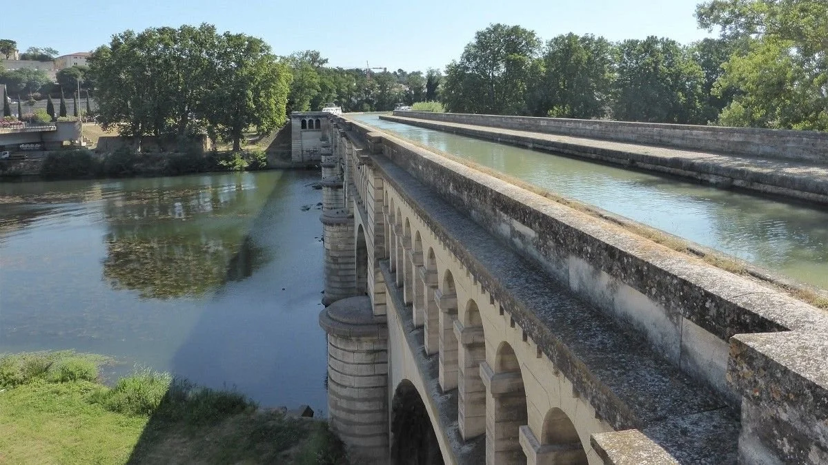 The Canal du Midi crosses the river below Beziers using the Orb viaduct.