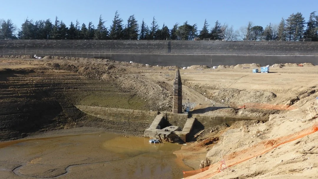 In this view of the dam of Saint-Ferréol in the Montagne Noire, the reservoir has been drained for maintenance work, revealing an obelisk which was originally a depth gauge.